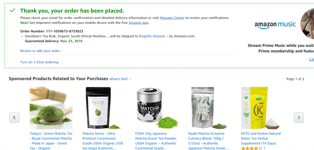 Amazon order confirmation page with sponsored products below.
